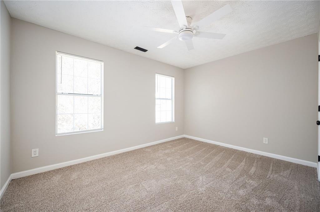3375 River Run Trail Decatur, GA 30034 - Photo 14 of 27 an empty room with windows and fan
