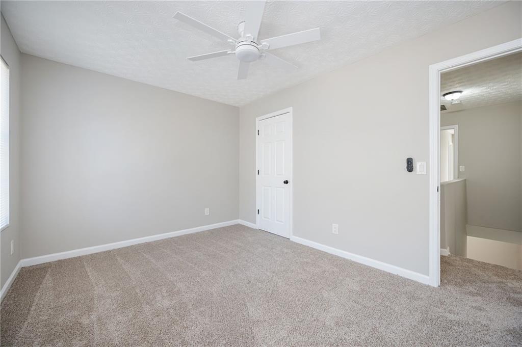 3375 River Run Trail Decatur, GA 30034 - Photo 15 of 27 an empty room with fan and entrance