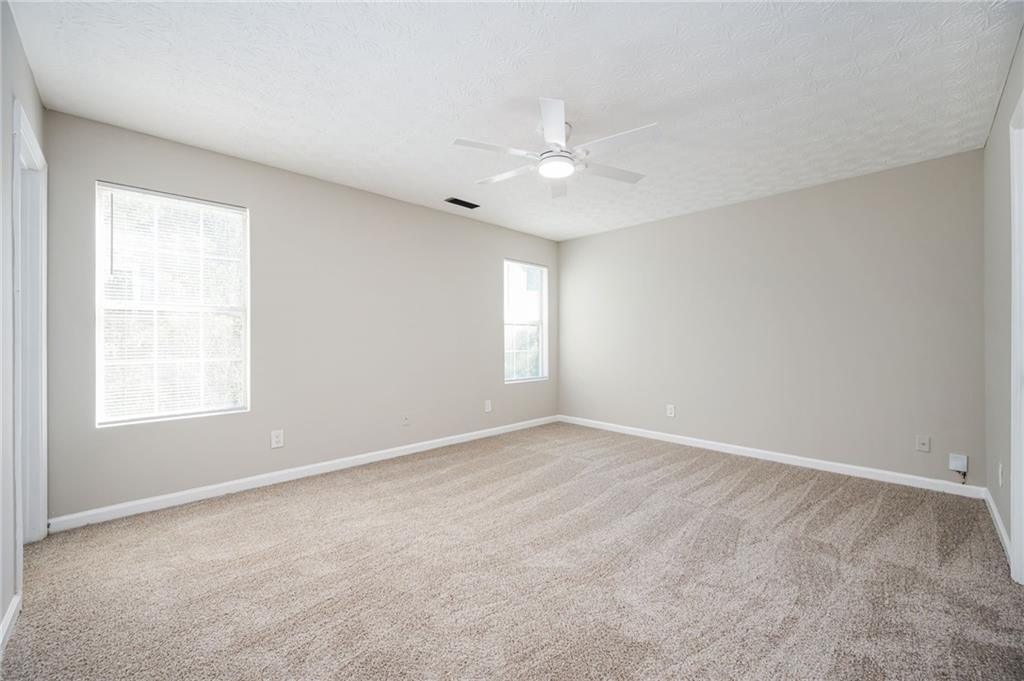 3375 River Run Trail Decatur, GA 30034 - Photo 16 of 27 an empty room with a window and a fan