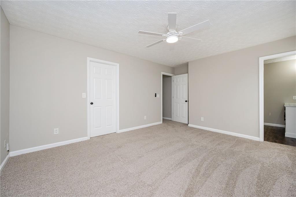 3375 River Run Trail Decatur, GA 30034 - Photo 17 of 27 a view of an empty room with a ceiling fan