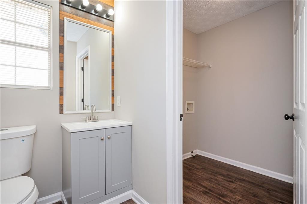 3375 River Run Trail Decatur, GA 30034 - Photo 21 of 27 a bathroom with a toilet a sink and mirror