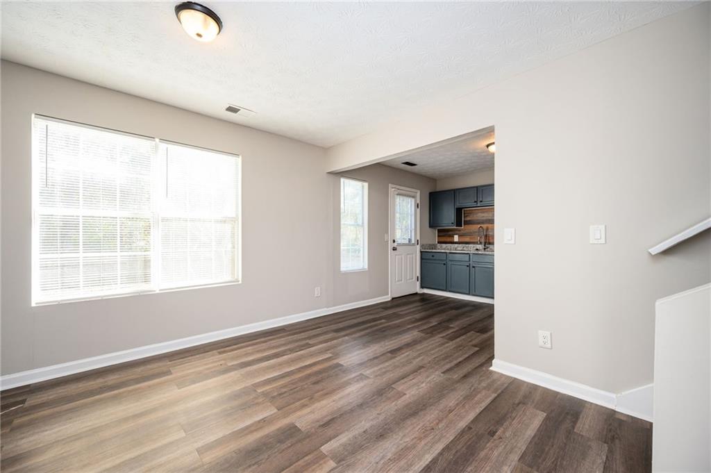 3375 River Run Trail Decatur, GA 30034 - Photo 3 of 27 wooden floor in an empty room with a window
