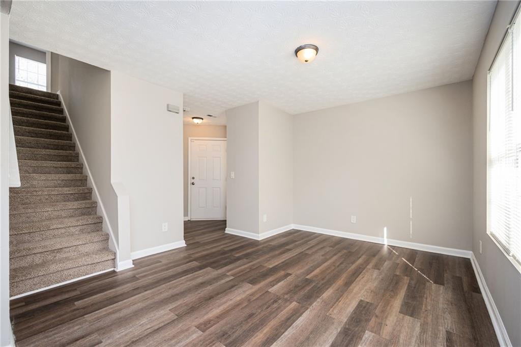 3375 River Run Trail Decatur, GA 30034 - Photo 5 of 27 wooden floor in an empty room with a window