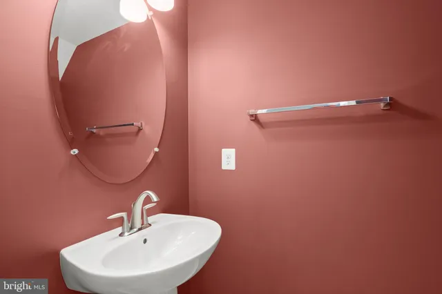 a bathroom with a sink and mirror