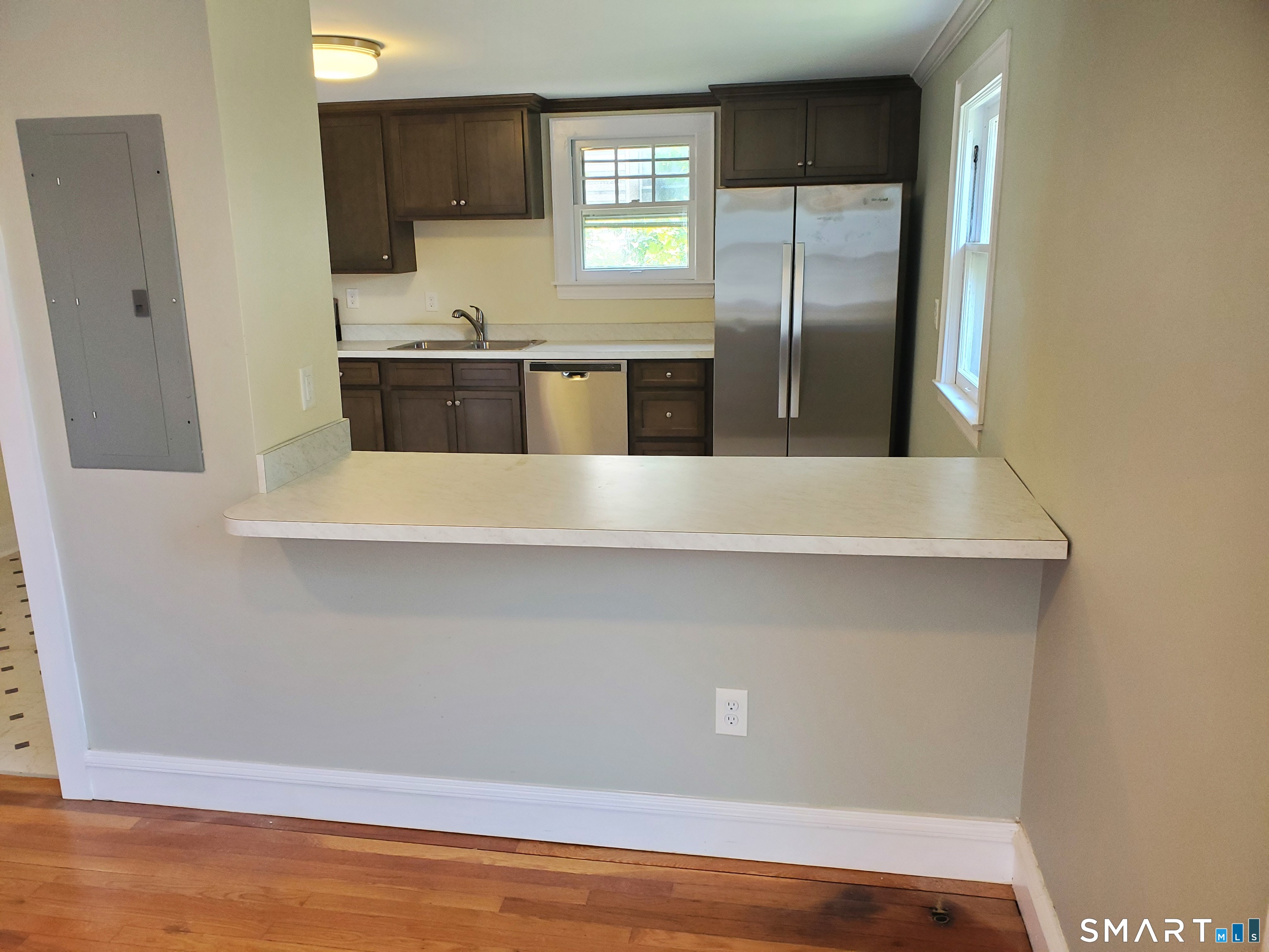 31 Bellevue Street Windham, CT 06226 - Photo 14 of 16 a view of a refrigerator in kitchen and an empty room