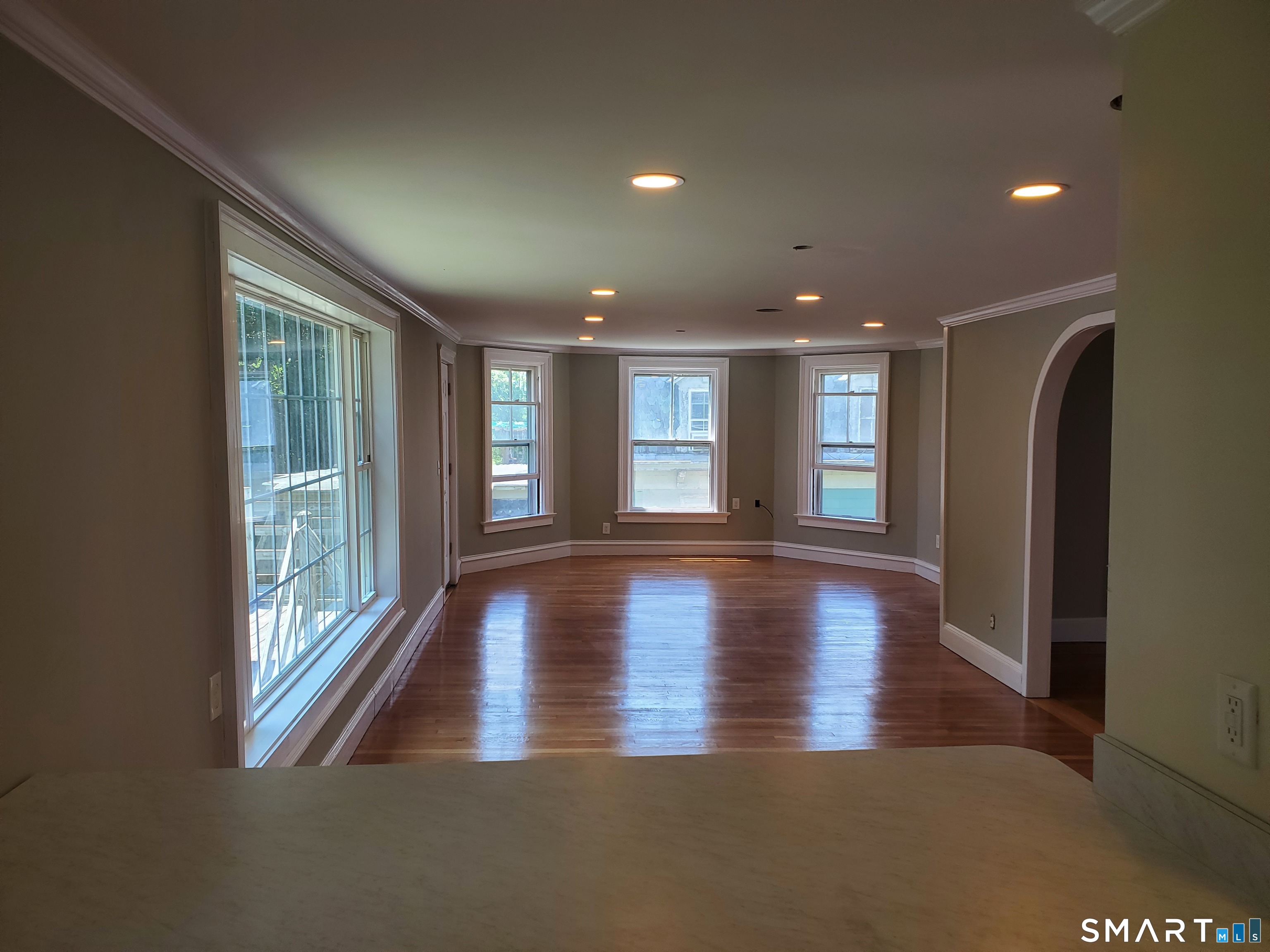 31 Bellevue Street Windham, CT 06226 - Photo 16 of 16 a view of an empty room with wooden floor and a window