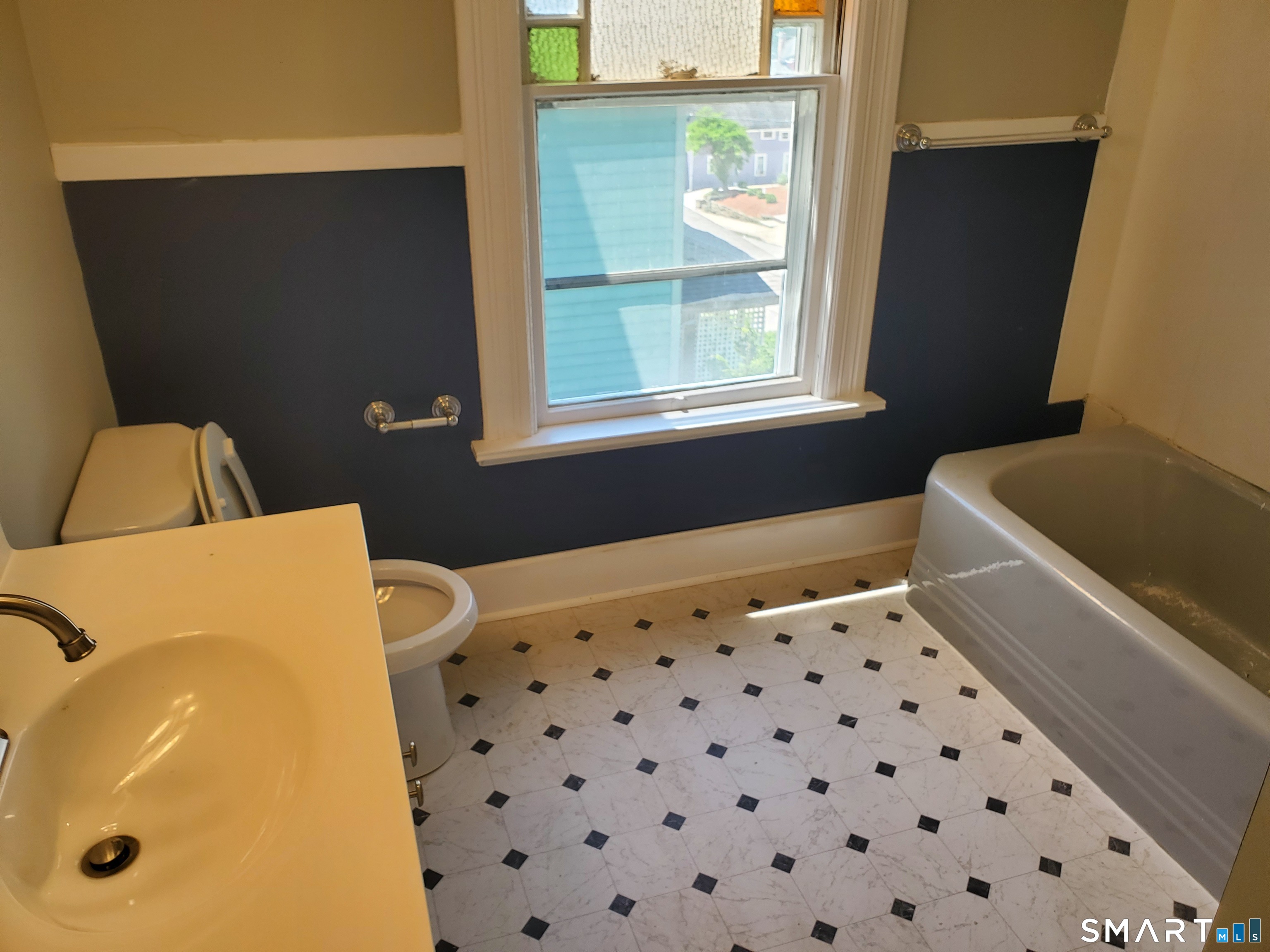 31 Bellevue Street Windham, CT 06226 - Photo 7 of 16 a bathroom with a sink and a bathtub