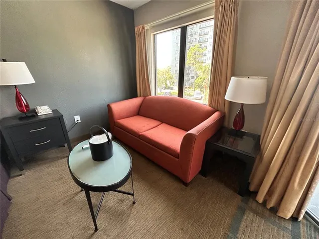 a bedroom with a bed and a lamp