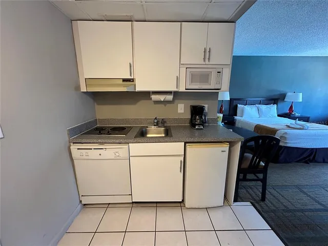 a kitchen with a cabinets and appliances