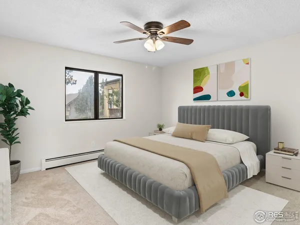 an empty room with a window and a ceiling fan