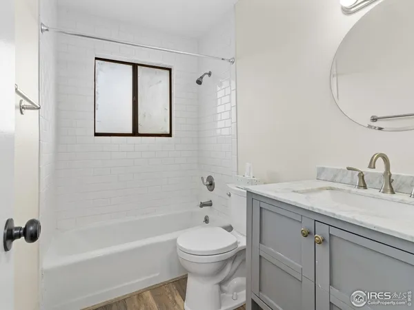 a bedroom with a bed and a potted plant