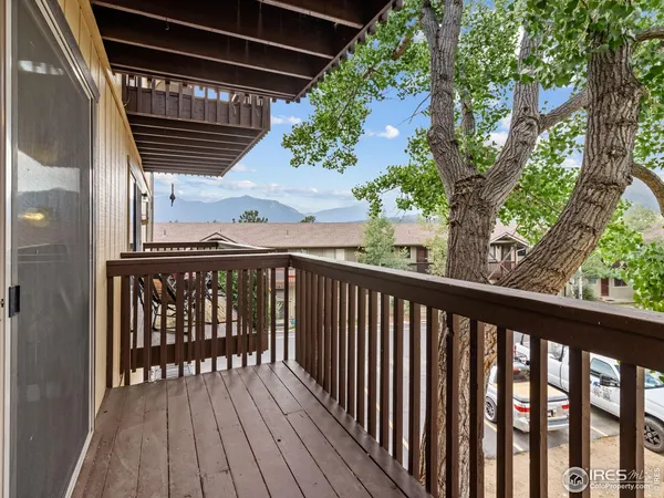 a kitchen with appliances a refrigerator and cabinets