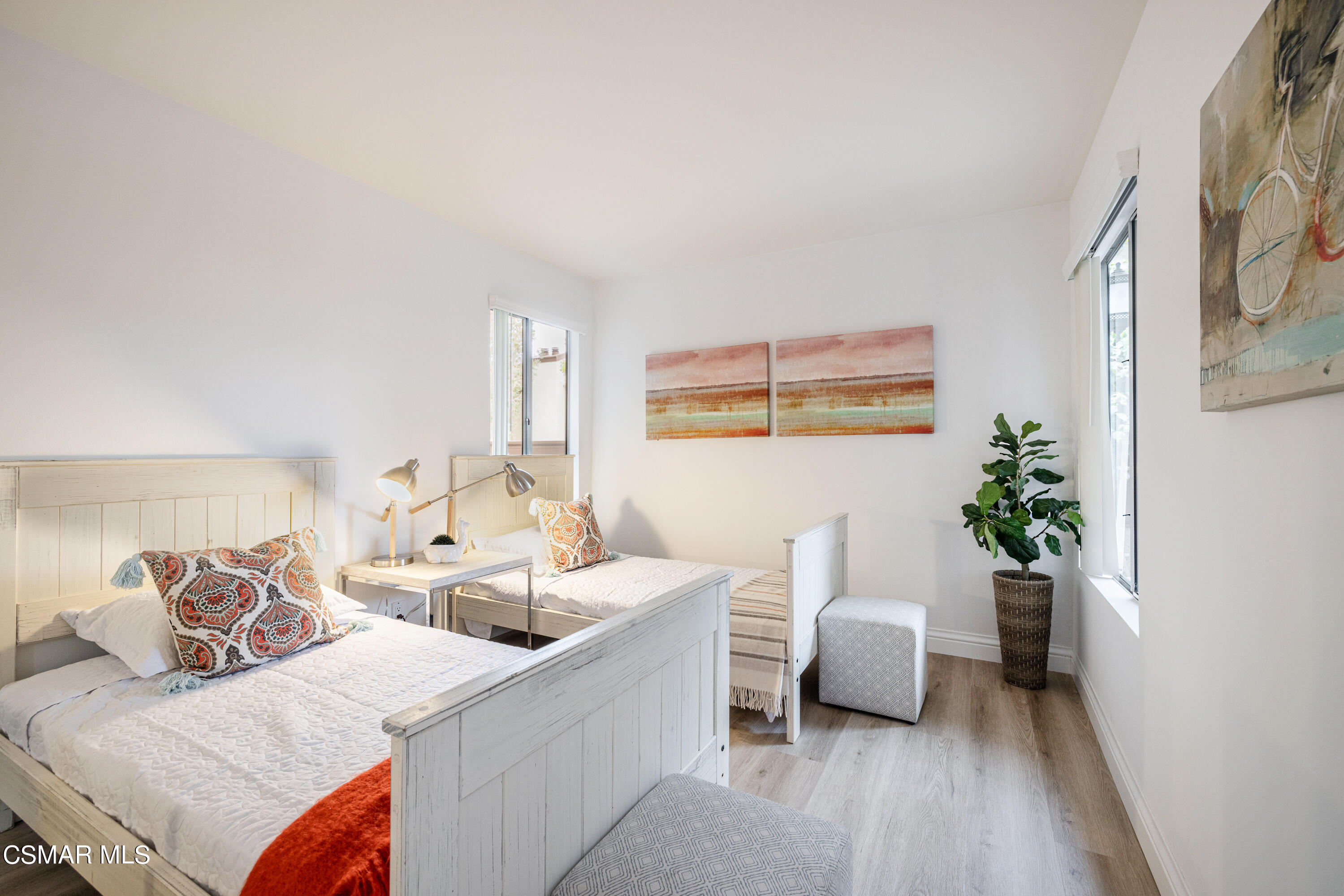 1736 Sinaloa Road, Unit 313 Simi Valley, CA 93065 - Photo 14 of 27 a living room with furniture and a potted plant
