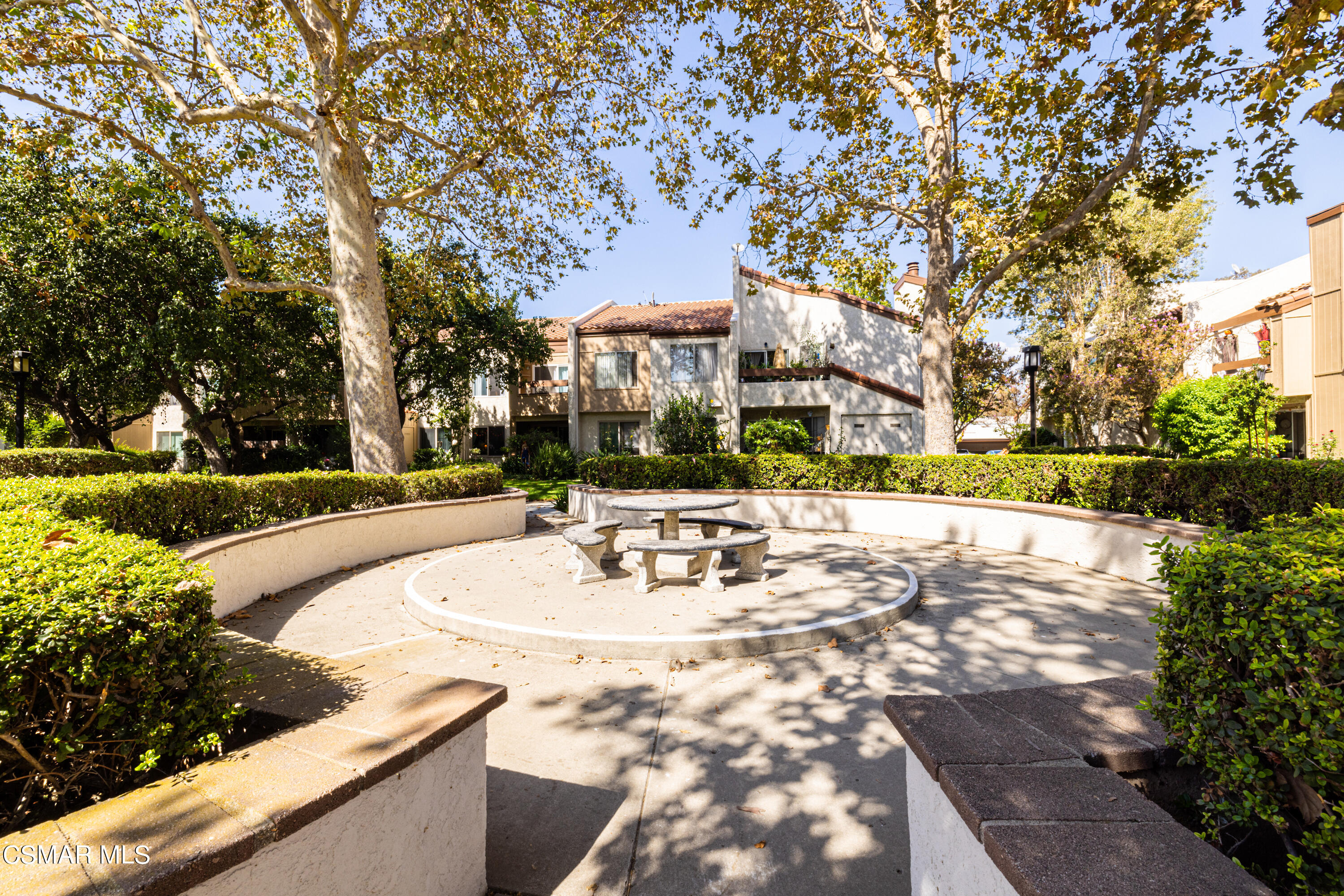1736 Sinaloa Road, Unit 313 Simi Valley, CA 93065 - Photo 26 of 27 a view of outdoor space with seating area and trees around