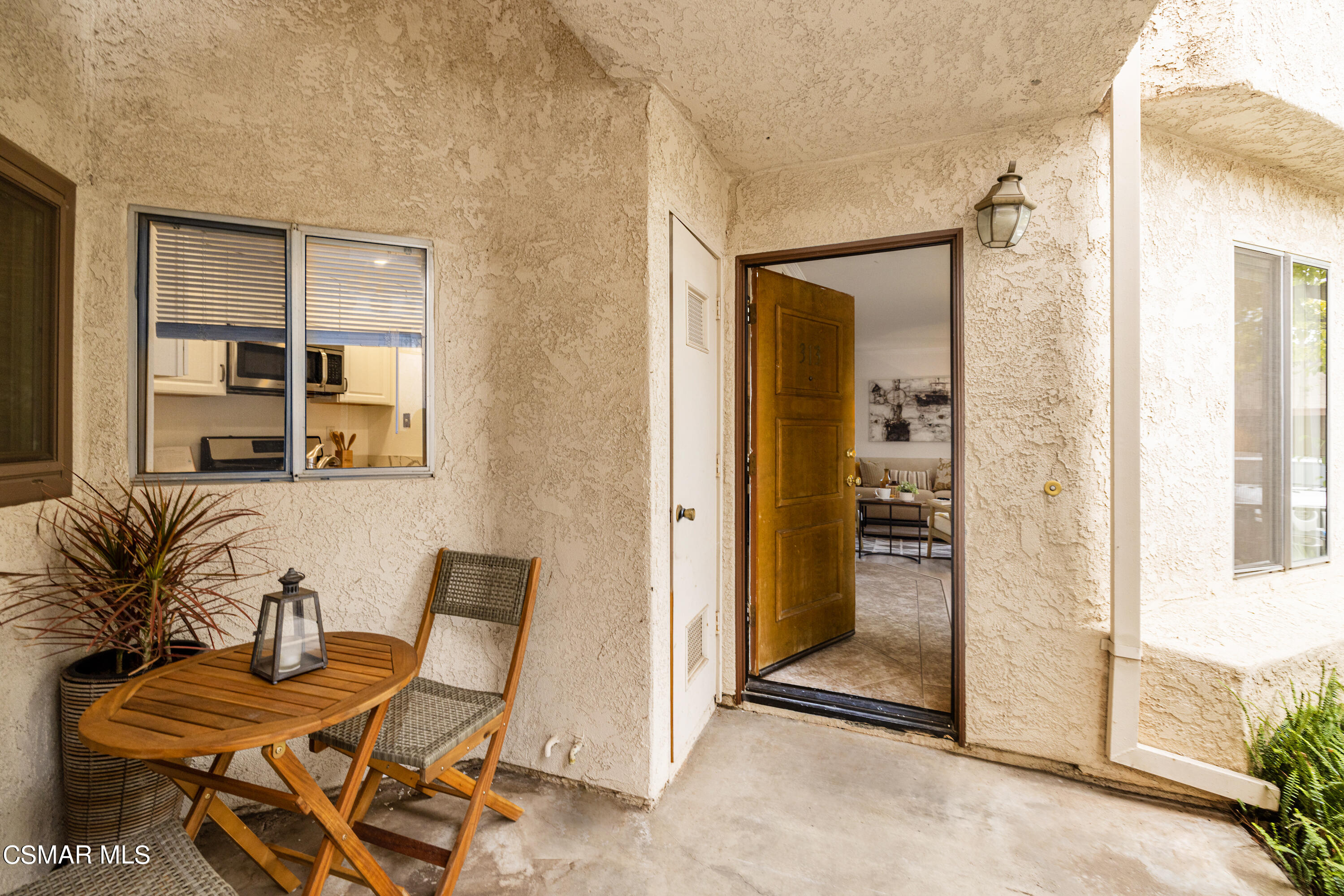 1736 Sinaloa Road, Unit 313 Simi Valley, CA 93065 - Photo 3 of 27 a view of a livingroom with furniture and front door