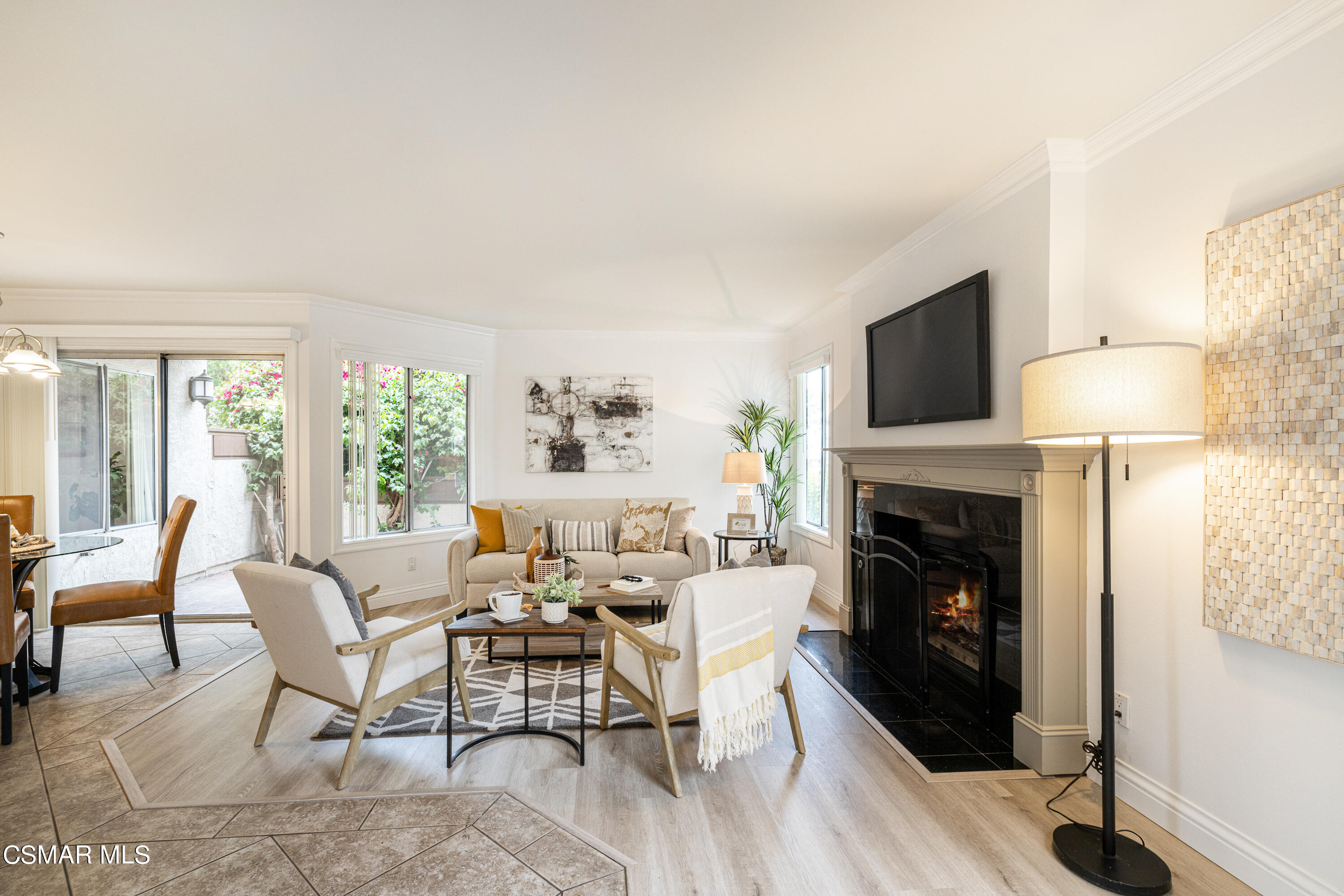 1736 Sinaloa Road, Unit 313 Simi Valley, CA 93065 - Photo 4 of 27 a living room with furniture a fireplace and a flat screen tv