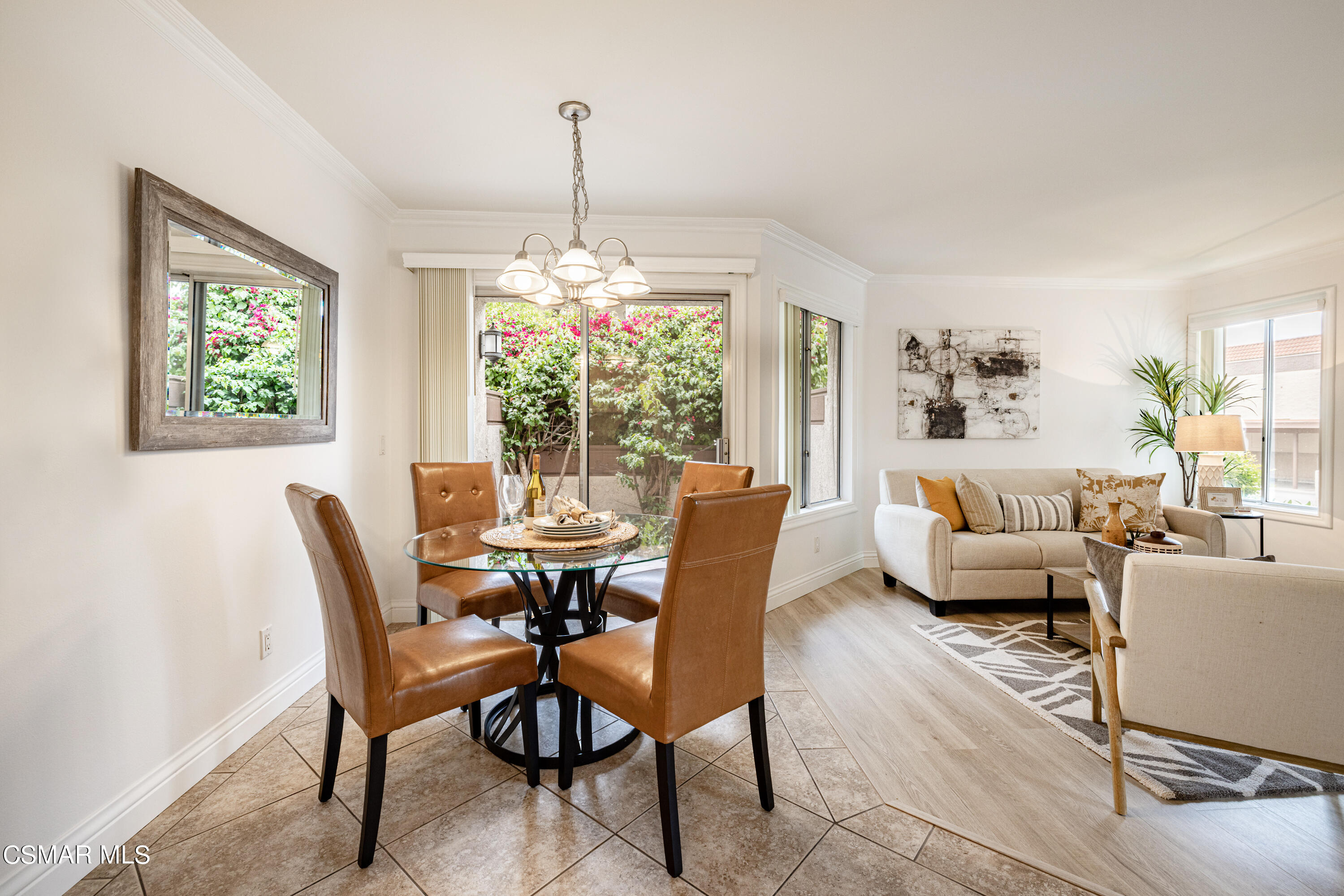 1736 Sinaloa Road, Unit 313 Simi Valley, CA 93065 - Photo 5 of 27 a dining room with furniture a chandelier and window
