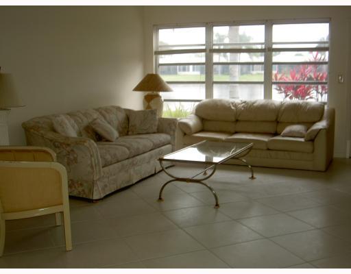 18999 Stewart Circle, Unit 3 Boca Raton, FL 33496 - Photo 4 of 14 a living room with furniture and a window