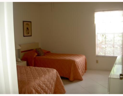 18999 Stewart Circle, Unit 3 Boca Raton, FL 33496 - Photo 6 of 14 a bedroom with a bed and a window