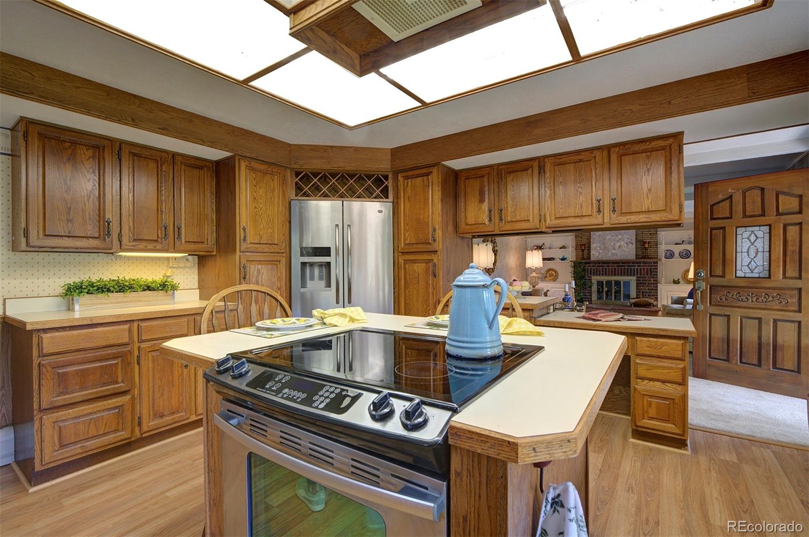 11655 Ranch Elsie Road Golden, CO 80403 - Photo 17 of 36 a kitchen that has a sink and a stove in it