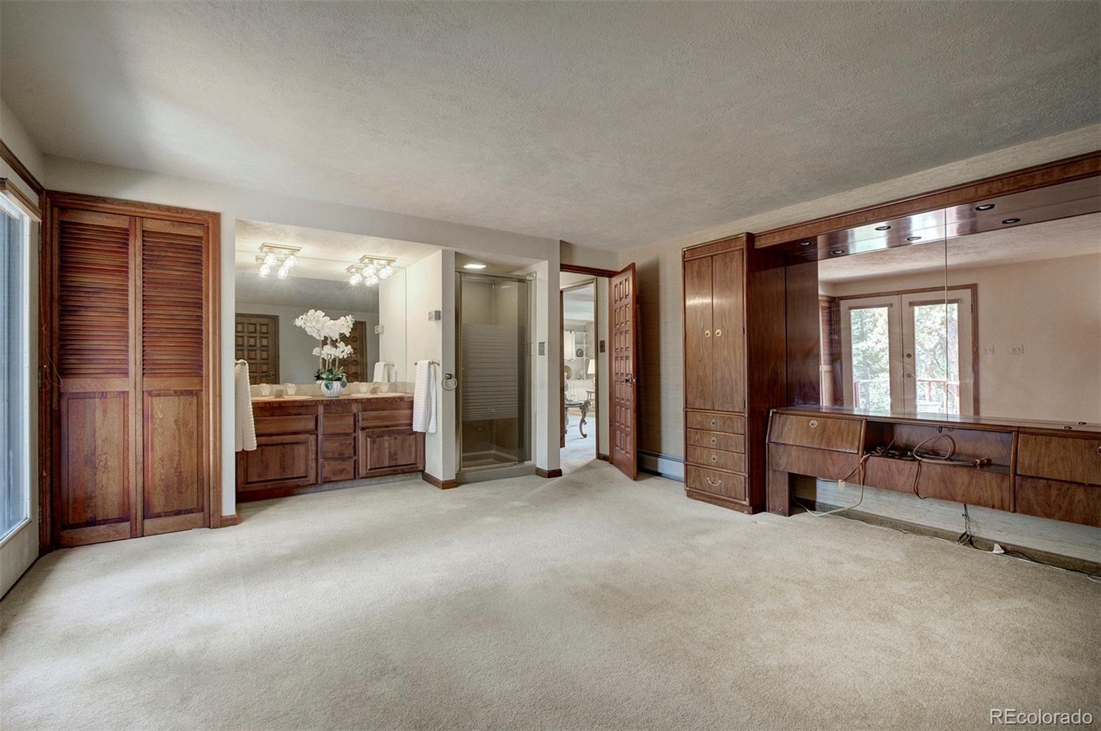 11655 Ranch Elsie Road Golden, CO 80403 - Photo 29 of 36 a view of a livingroom with furniture and windows