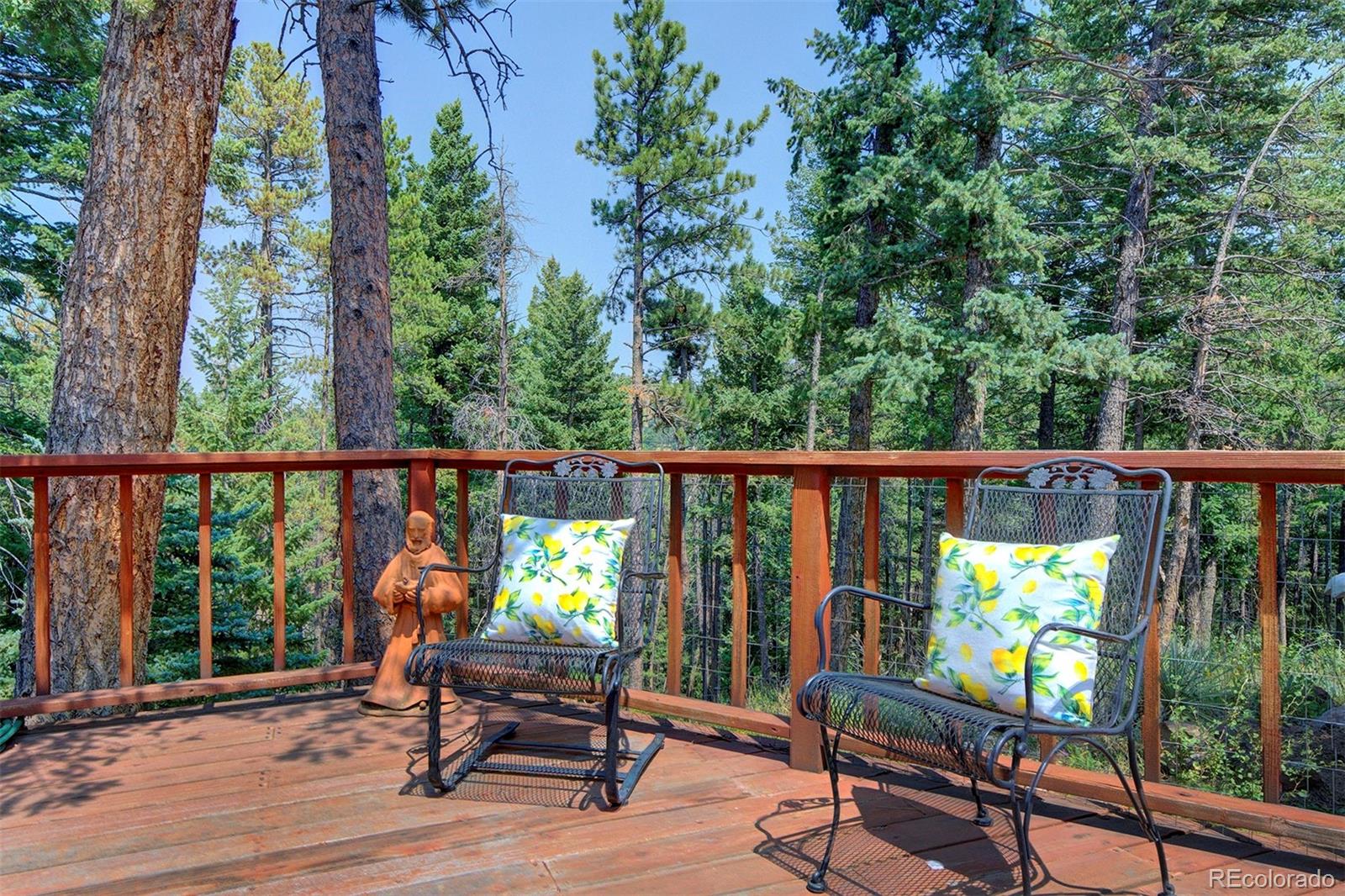 11655 Ranch Elsie Road Golden, CO 80403 - Photo 35 of 36 a view of a two chairs in the balcony