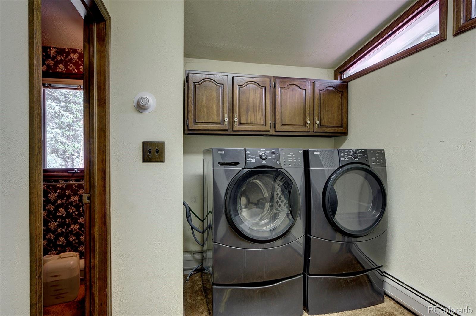 11655 Ranch Elsie Road Golden, CO 80403 - Photo 36 of 36 a view of a livingroom with washer and dryer