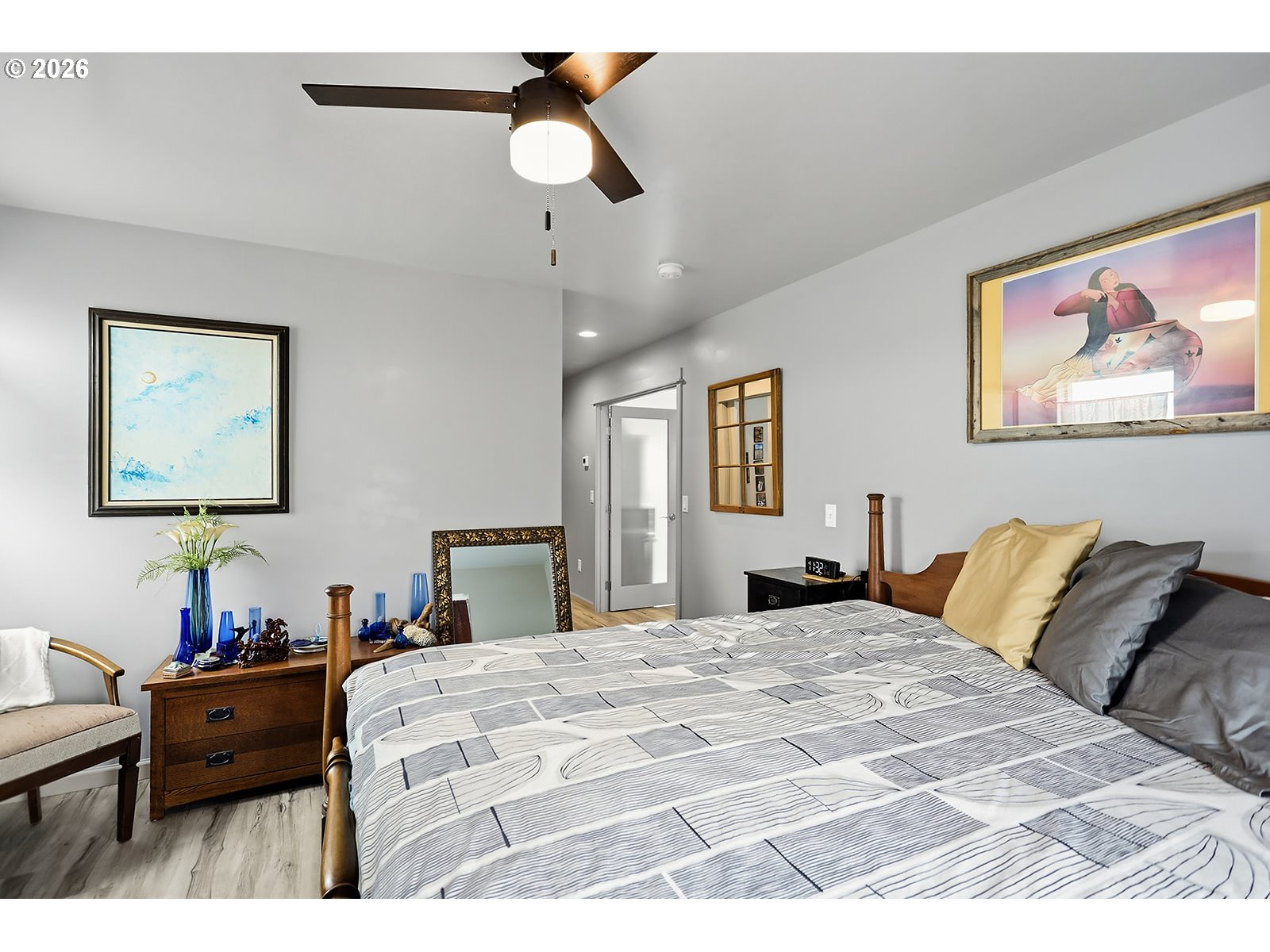 15 Levin Lane Goldendale, WA 98620 - Photo 23 of 47 a bedroom with a large bed and a chandelier