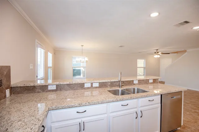 a bathroom with double sink and a mirror