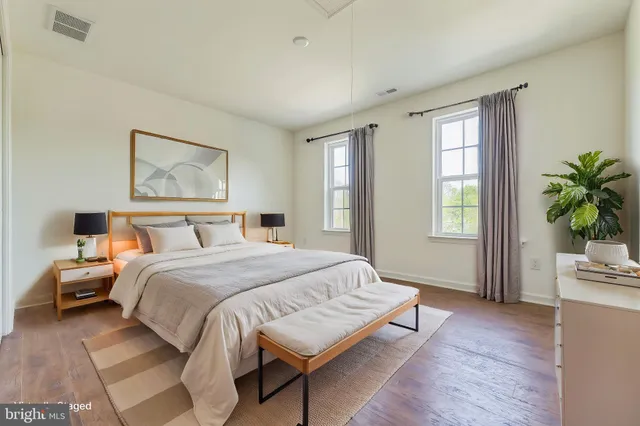 a bedroom with bed and window