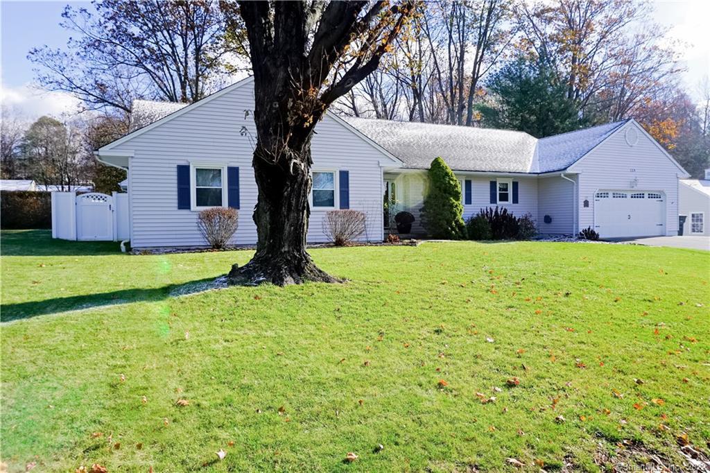 129 Pineridge Road Torrington, CT 06790 - Photo 1 of 1 a view of a house with a yard and large tree