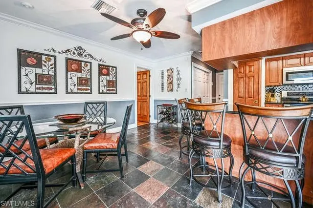 a dining room with furniture and window