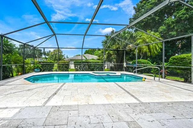 a view of a backyard with a swimming pool