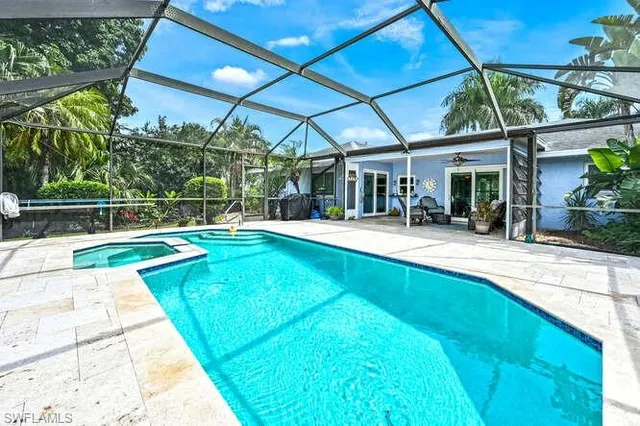 a view of a swimming pool with a patio