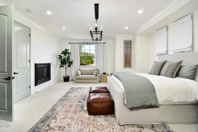 a bedroom with a bed and a couch