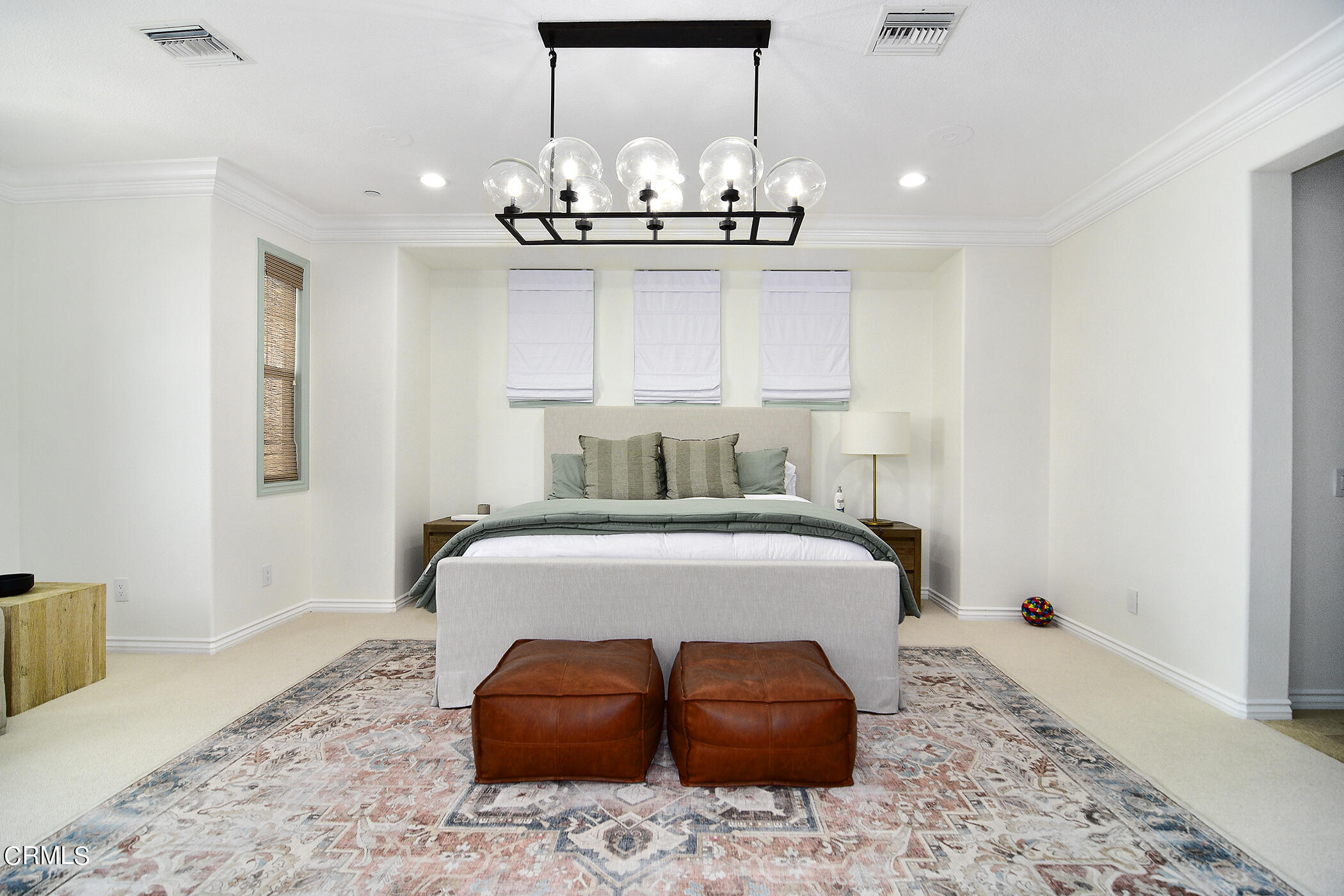 4011 Adriatic Street Oxnard, CA 93035 - Photo 22 of 31 a bedroom with a bed and chandelier