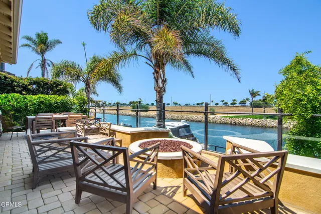 a view of a swimming pool with a table and chairs