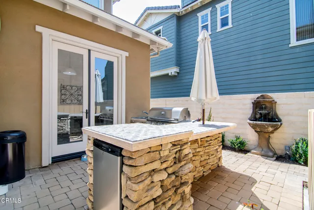 a spacious bathroom with a granite countertop sink and a toilet