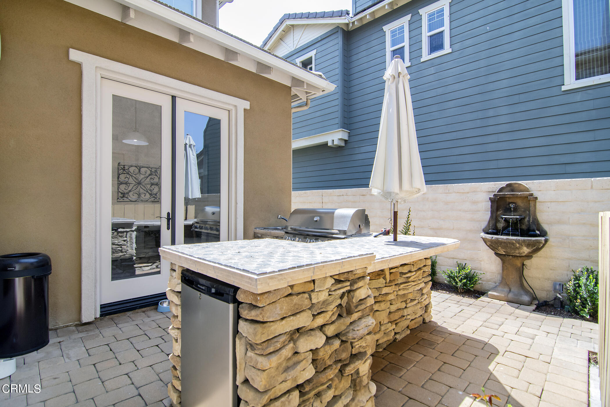 4011 Adriatic Street Oxnard, CA 93035 - Photo 30 of 31 a spacious bathroom with a granite countertop sink and a toilet