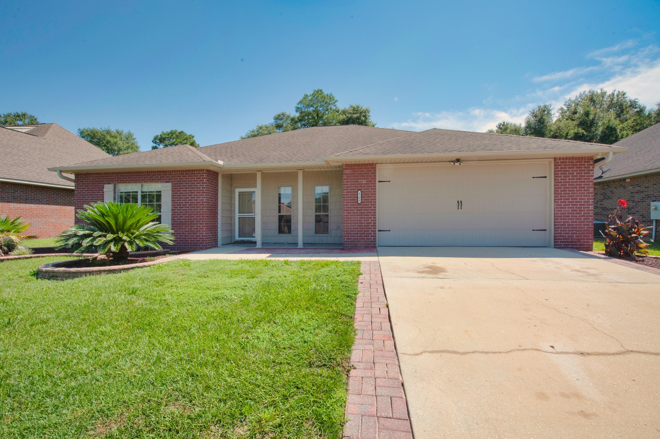 4586 Hermosa Road Crestview, FL 32539 - Photo 1 of 26 a house view with a garden space