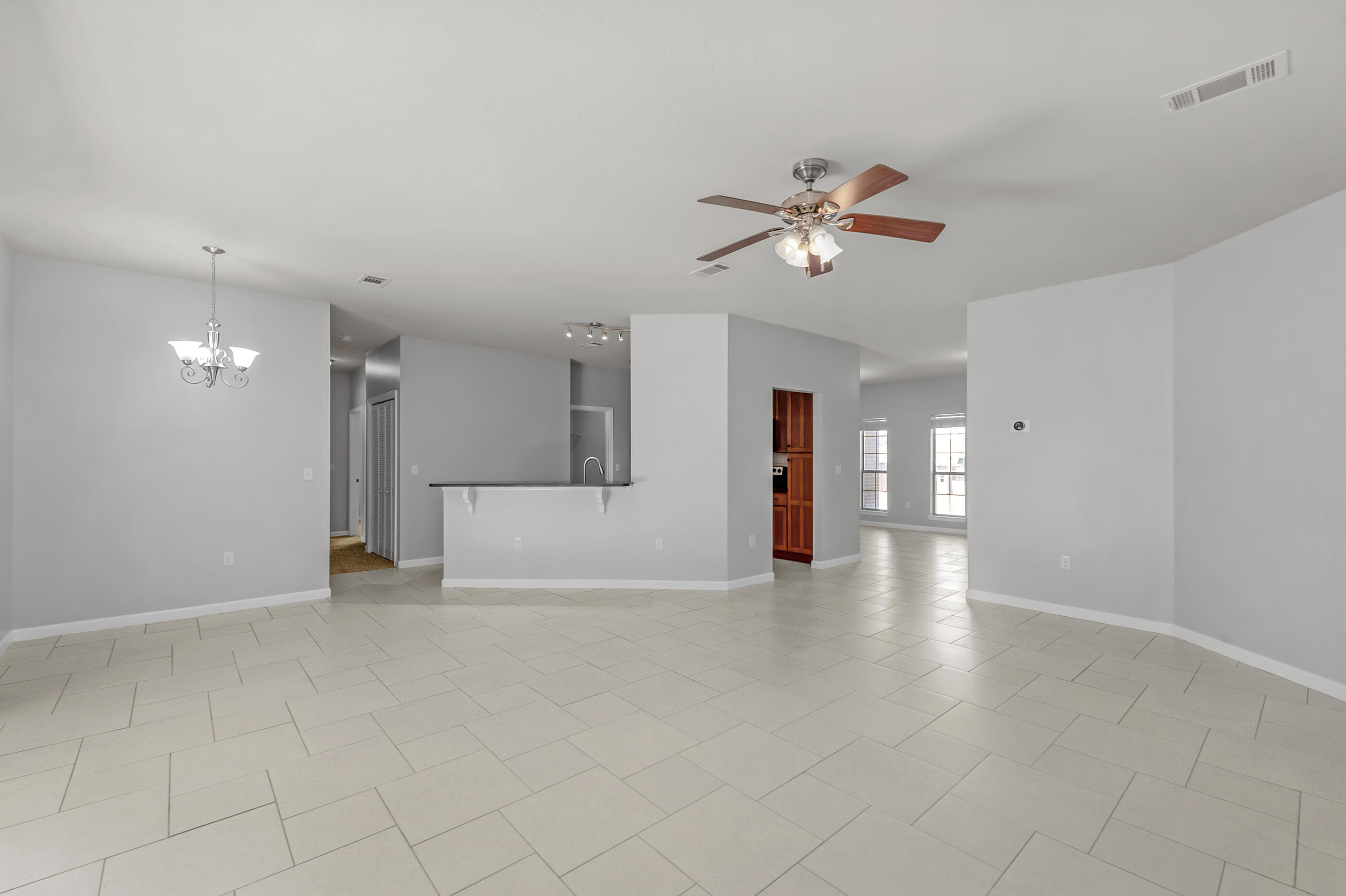 4586 Hermosa Road Crestview, FL 32539 - Photo 8 of 26 a view of an empty room with a ceiling fan