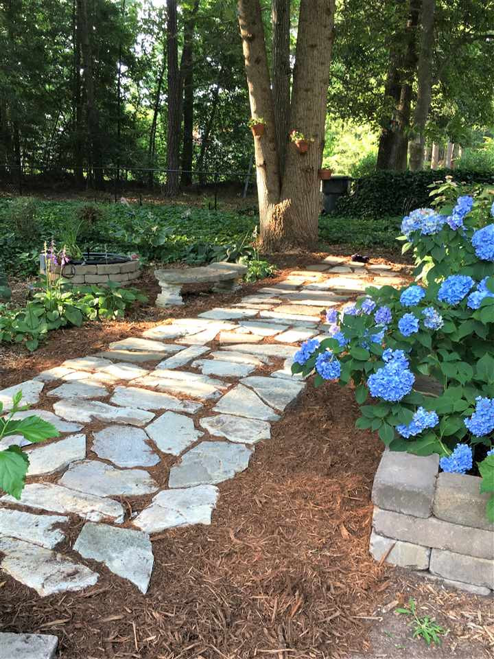 9448 Ferrell Road Zebulon, NC 27597 - Photo 30 of 30 Stone Walkway with Hydrangeas
