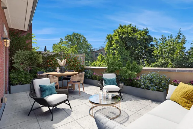a view of a chairs and table in the patio