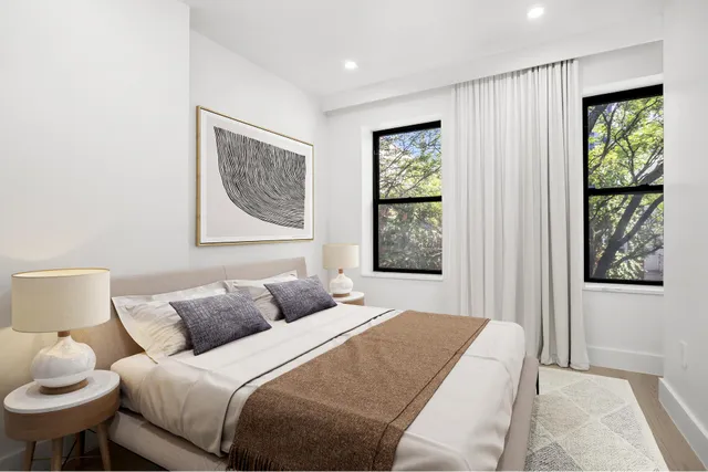 a kitchen with a sink appliances and cabinets