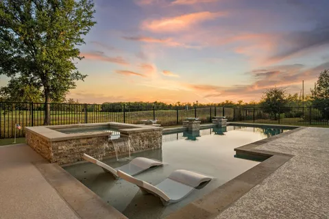 a view of a swimming pool with a lake view