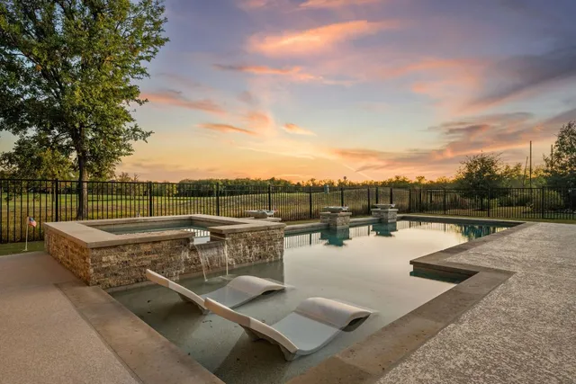 a view of a swimming pool with a lake view