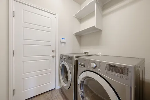 a view of washer and dryer in a utility room