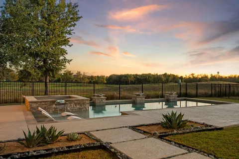 a view of a swimming pool with a patio