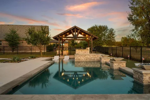 a view of a swimming pool with a patio