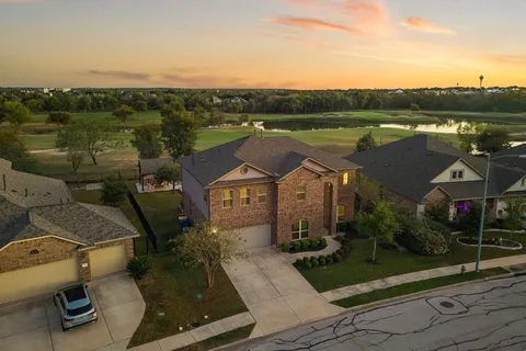 an aerial view of a house with a lake view